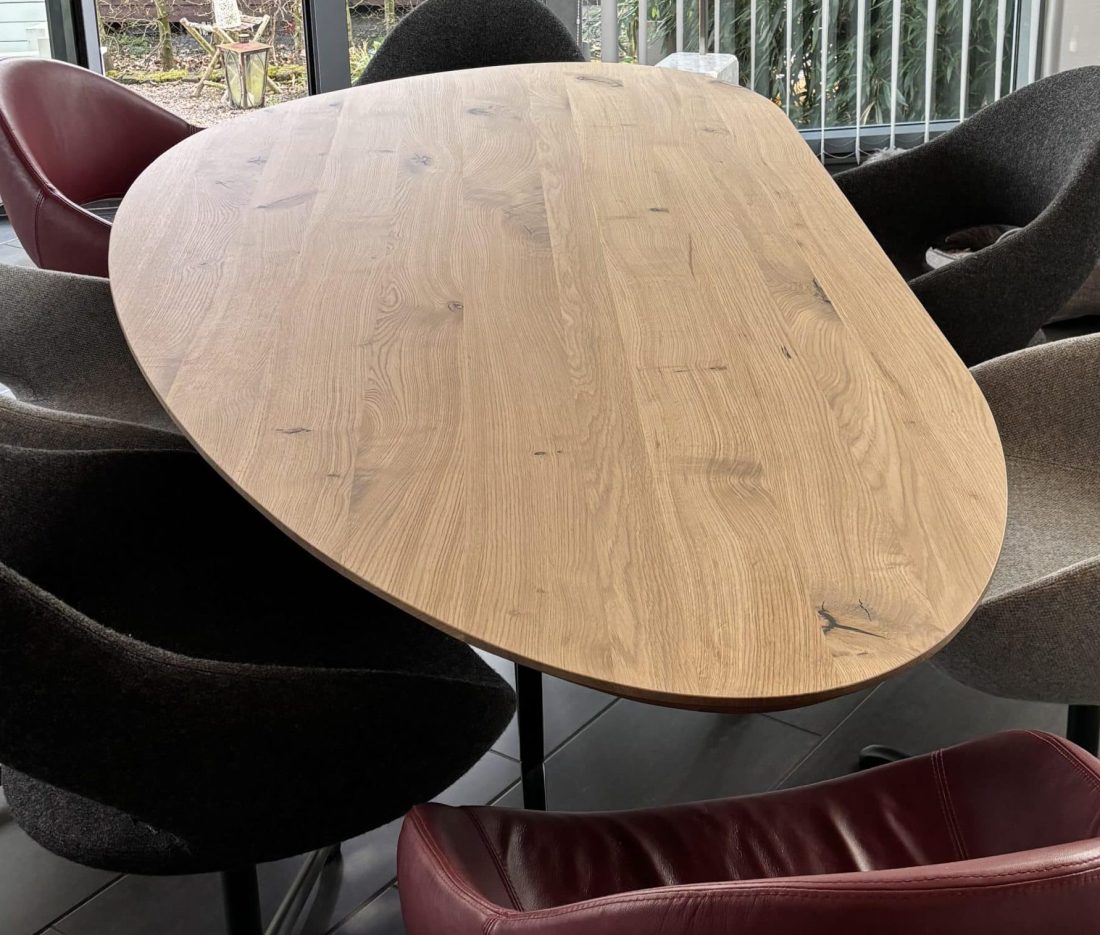 Organa organic oak table in right-hand shape 240x110x4cm with tapered edge 1x60 degrees with matrix thin 3x3cm black coating