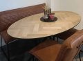 Milin oval herringbone oak table 160 x 100 x 4cm with tapered edge 1x45 black with matrix thin 3x3cm black coating