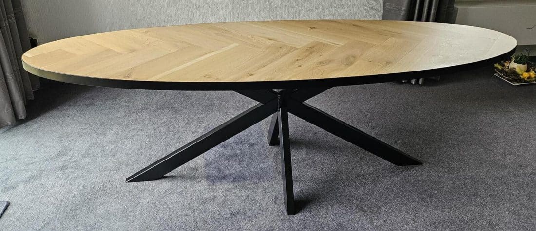 Milin oval herringbone oak table 240 x 80 x 4cm with metal strap with black coating with matrix base 8 x 4 with black coating