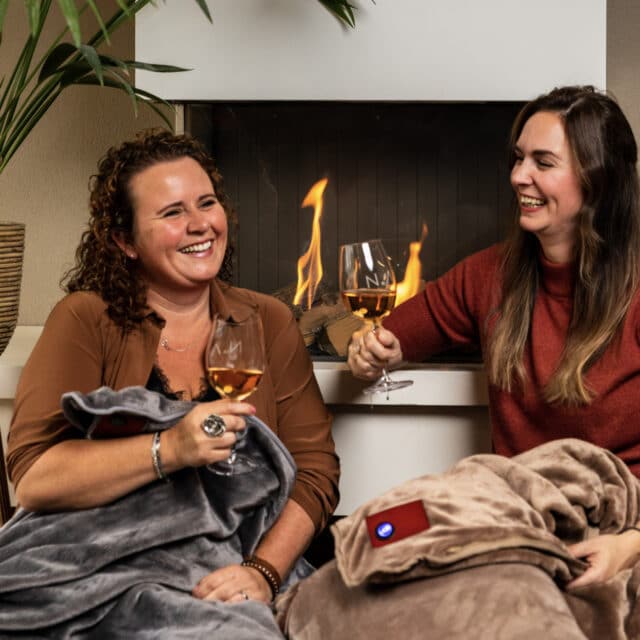 cosy in front of the fireplace with a warming blanket