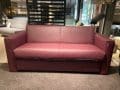 Finesse sofa bed with purple leather upholstery as showroom model