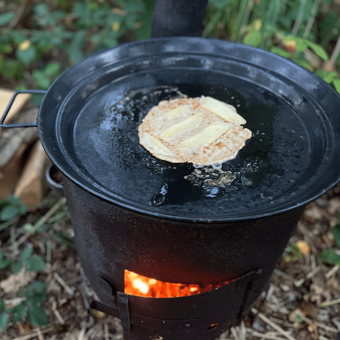 Bake pancakes with the kids on the outdoor stove