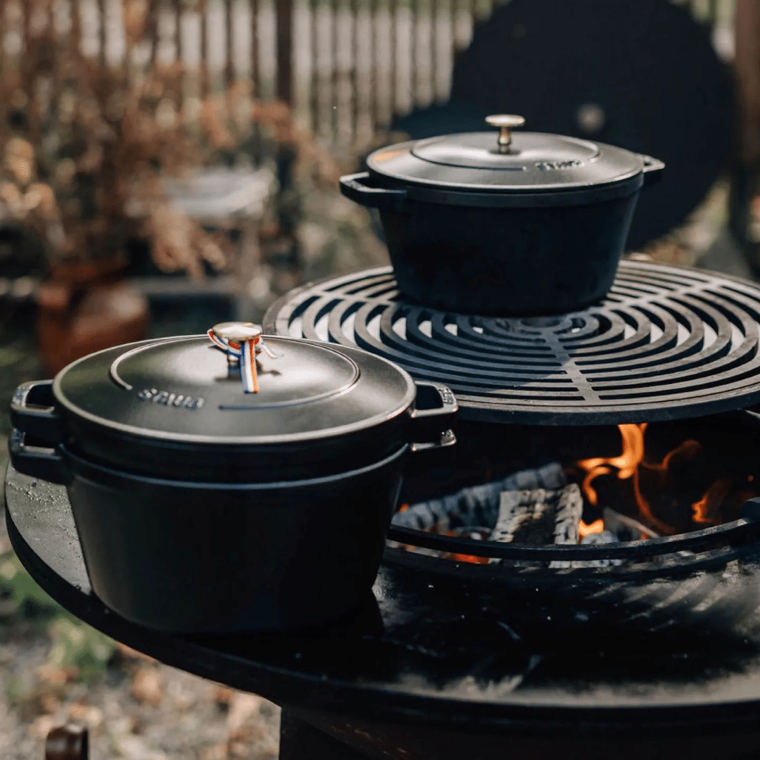 OFYR Staub pan set on grill round and plancha